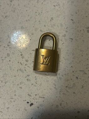 Louis Vuitton Gold Lock 301